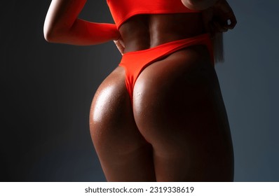 Perfect sexy butt. Ideal womans butt. Anti-cellulite and skin care butt. Sexy butt with sensual touch. Erotic. Great ass. Sexy female wearing of pants. Sexual girl takes off bikini. Seductive woman.