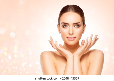 Perfect Skin Face Woman Portrait. Beauty Model with open Hands under Chin over Bright Shining Beige Background. Skin Care Cosmetic Cosmetology