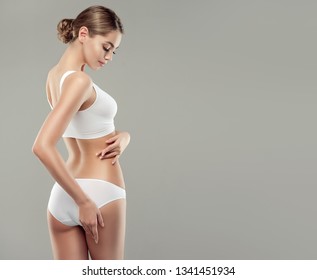 Perfect slim toned young body of the girl . An example of sports , fitness or plastic surgery and aesthetic cosmetology. - Shutterstock ID 1341451934