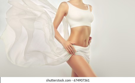 Perfect slim toned young body of the girl . An example of sports , fitness or plastic surgery and aesthetic cosmetology. Healthy Breast . - Shutterstock ID 674907361