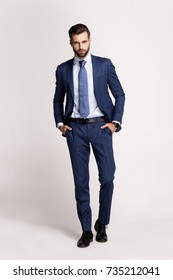 Perfect Suit. Full Length Of Handsome Young Man In Suit Looking At Camera While Standing Against White Background.