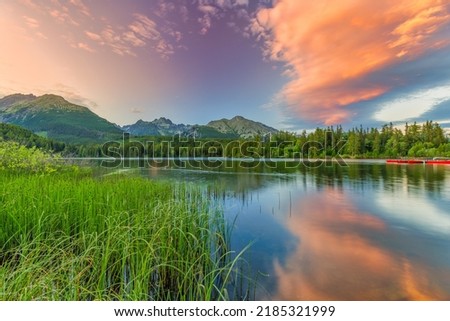 Perfect summer landscape. Idyllic travel background, beauty in nature concept. Tatra mountains forest sunset lake view. Amazing clouds and water reflection, relaxing freedom adventure natural scenic