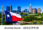 Perfect Texas Flag waving in front of the Perfect Austin Texas USA Skyline representing the Lone Star State with Drone view of our Iconic Capital City 