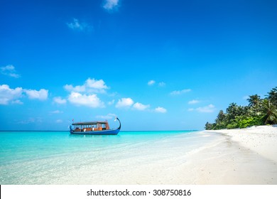 Perfect tropical island paradise beach and boat, Maldives