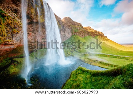 Perfect view of famous powerful Seljalandsfoss waterfall in sunlight. Dramatic and gorgeous scene. Popular tourist attraction. Location place Iceland, sightseeing Europe. Discover the world of beauty
