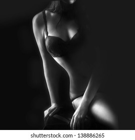Perfect woman body on black background