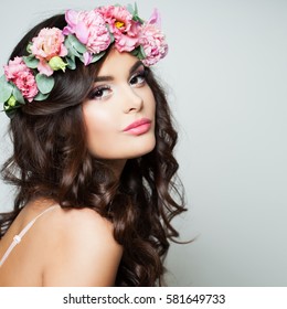 Perfect Woman Fashion Model With Healthy Skin And Flowers Wreath. Spring Beauty