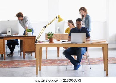 Perfect Work Environment. Shot Of Young Professionals Working In An Office.