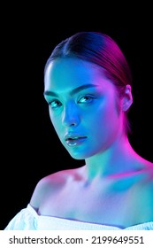 Perfection  Beauty portrait young adorable woman and well  kept skin isolated over dark background in purple neon light  Concept art  fashion  style  inspiration  emotions  Copy space for ad