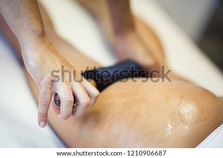  Perfection body. Woman on anti cellulite massage treatment. Close up. Copy space. Focus on foreground.