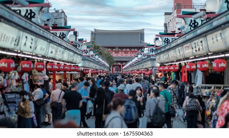 A perfectly balanced picture of the Asakusa traditional craft shops and street-food stalls full of tourists and shoppers with the Sensō-ji temple in the background, October 9th, 2019, Tokyo, Japan.