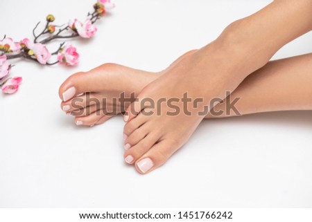 Perfectly done french pedicure on white background.
