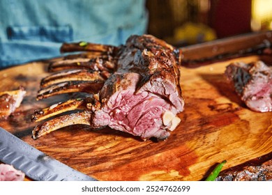 Perfectly grilled lamb chops on a wooden board, accompanied by fresh vegetables and garnished with herbs, ready to serve. - Powered by Shutterstock