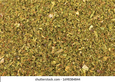Perfectly grinded green dried marijuana background. Cannabis texture. Close up of marijauna pattern.