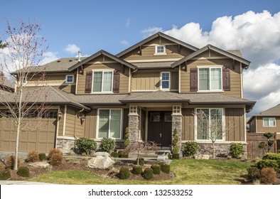 Perfectly Manicured Suburban House On A Beautiful Sunny Day