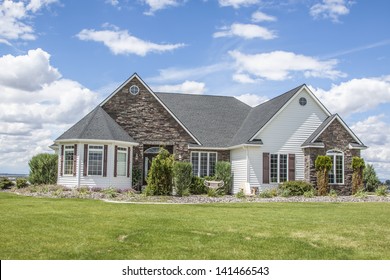 Perfectly Manicured Suburban House On A Beautiful Sunny Day  