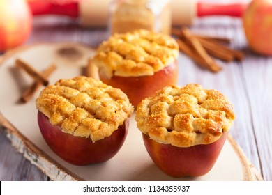 Perfectly for season holiday: stuffed and spiced baked apple treats. Creative apple dessert with cinnamon and sugar crust - Powered by Shutterstock