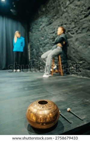 Perfomance Backdrop Featuring Hushed Concentration And Textured Scenery