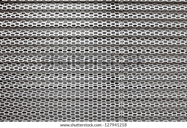 Perforated Decorative Metal Grate Textural Background Stock Photo