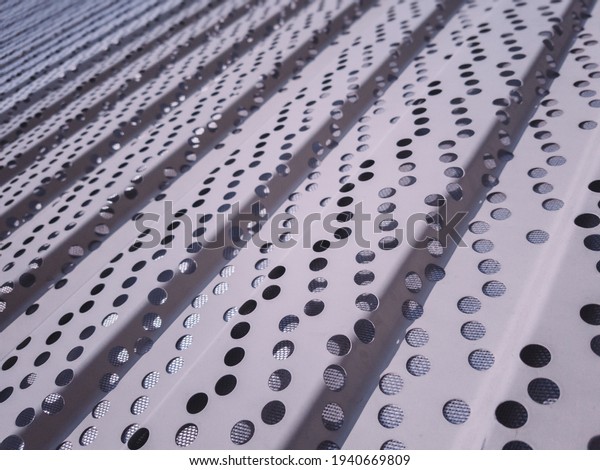 Perforated metal panels with\
an additional insulating fabric layer. Decorative panels for\
dividing spaces.