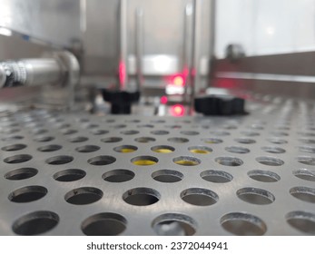 Perforated metal sheet that sits in the machine