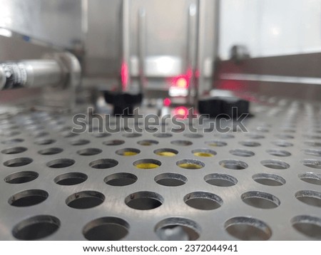 Perforated metal sheet that sits in the machine