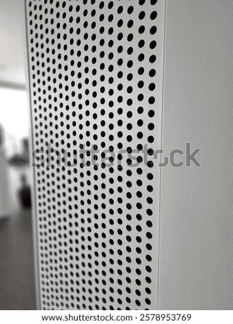 perforated plasterboard ceiling panels shatter echo in a large hall with tiled floor. entrance hall in a hotel where sounds must be muffled, press, surround sound, cladding