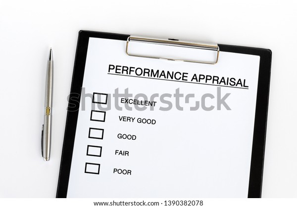 Performance Appraisal checklist on attached on\
Clip board and pen on white\
background