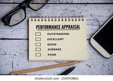 Performance Appraisal Checklist On Notepad With With Office Setting Background.