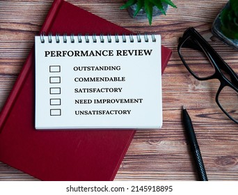 Performance Appraisal Checklist On Notepad With With Office Setting Background. Performance Review Concept