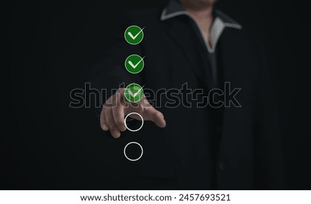 Performance checklist concept : businessman using finger with mobile phone for questionnaire, evaluation, assessment online or survey exam and filling out for digital survey and checklist.	