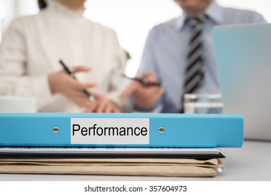 Performance Management Folder On Work Desk In Meeting Room. Planning Concept.