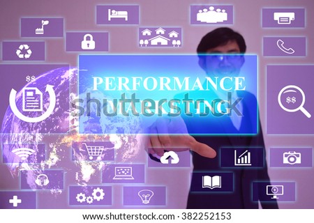PERFORMANCE  MARKETING concept  presented by  businessman touching on  virtual  screen ,image element furnished by NASA