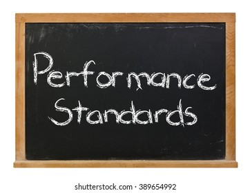 Performance Standards Written In White Chalk On A Black Chalkboard Isolated On White