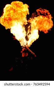 performer fire eater with big fire flame