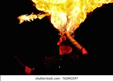 performer fire eater with big fire flame - Powered by Shutterstock