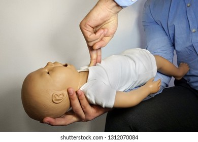 Performing Cpr On A Simulation Mannequin Baby Dummy During Medical Training Pediatric Basic Life Support