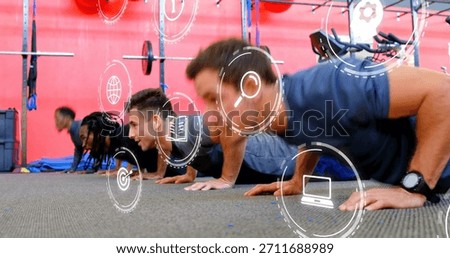 Performing four men doing push-ups in gym wearing athletic clothing, squat rack and overlay icons. Fitness, group, training, studio, weights, cycling, teamwork