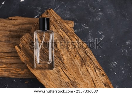 perfume bottle mockup, perfume bottle on wood, with black background. Stock foto © 