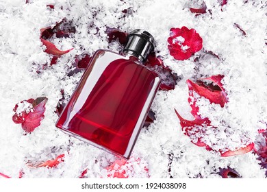 Perfume Bottle On Red Leaves Covered By Snow Background. Packaging Design Mockup. Branding Identity. Top View, Flat Lay.