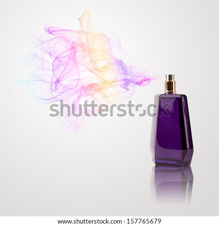 Perfume bottle spraying colorful scent