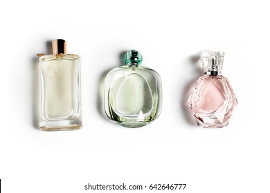 Perfume Bottles On Light Background. Perfumery, Cosmetics, Fragrance Collection.