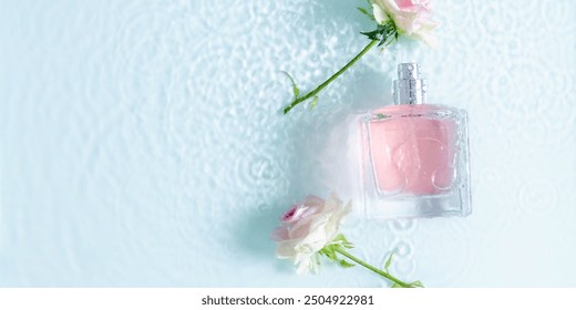 Perfume fragrance bottle on floral background. Top view of Transparent glass pink perfume bottle over rippled blue water background. splash of water. Flat lay, copy space - Powered by Shutterstock