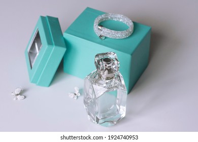 Perfume On A White Background With A Birch Box