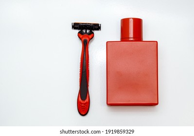 Perfume And Razor On A White Background. Men's Hygiene. Beard Care. Shave. Kit For Men. Set Of Shaving Equipment And Men's Cosmetic Products. For Men.