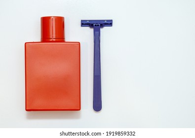 Perfume And Razor On A White Background. Men's Hygiene. Beard Care. Shave. Kit For Men. Set Of Shaving Equipment And Men's Cosmetic Products. For Men.