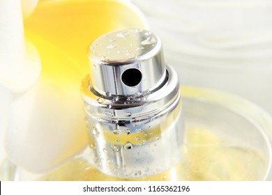 Perfume Spray Bottle Closeup, Yellow Frangipani Flower. Floral Scent Aromatherapy. 