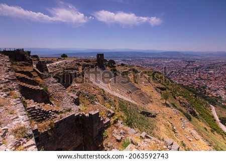 Pergamon Ancient City and Roman theater ruins above the modern city of Bergama, Izmir, Turkey..