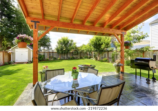 Pergola Patio Area Glass Top Table Royalty Free Stock Image