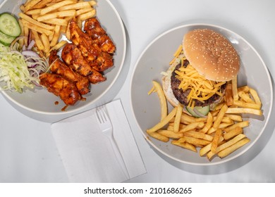 Peri Peri Chicken  Chips And A Cheeseburger  Potato Fries, Shot From Above